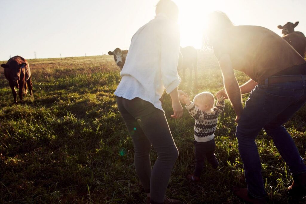 Livestock farming family together on their farm